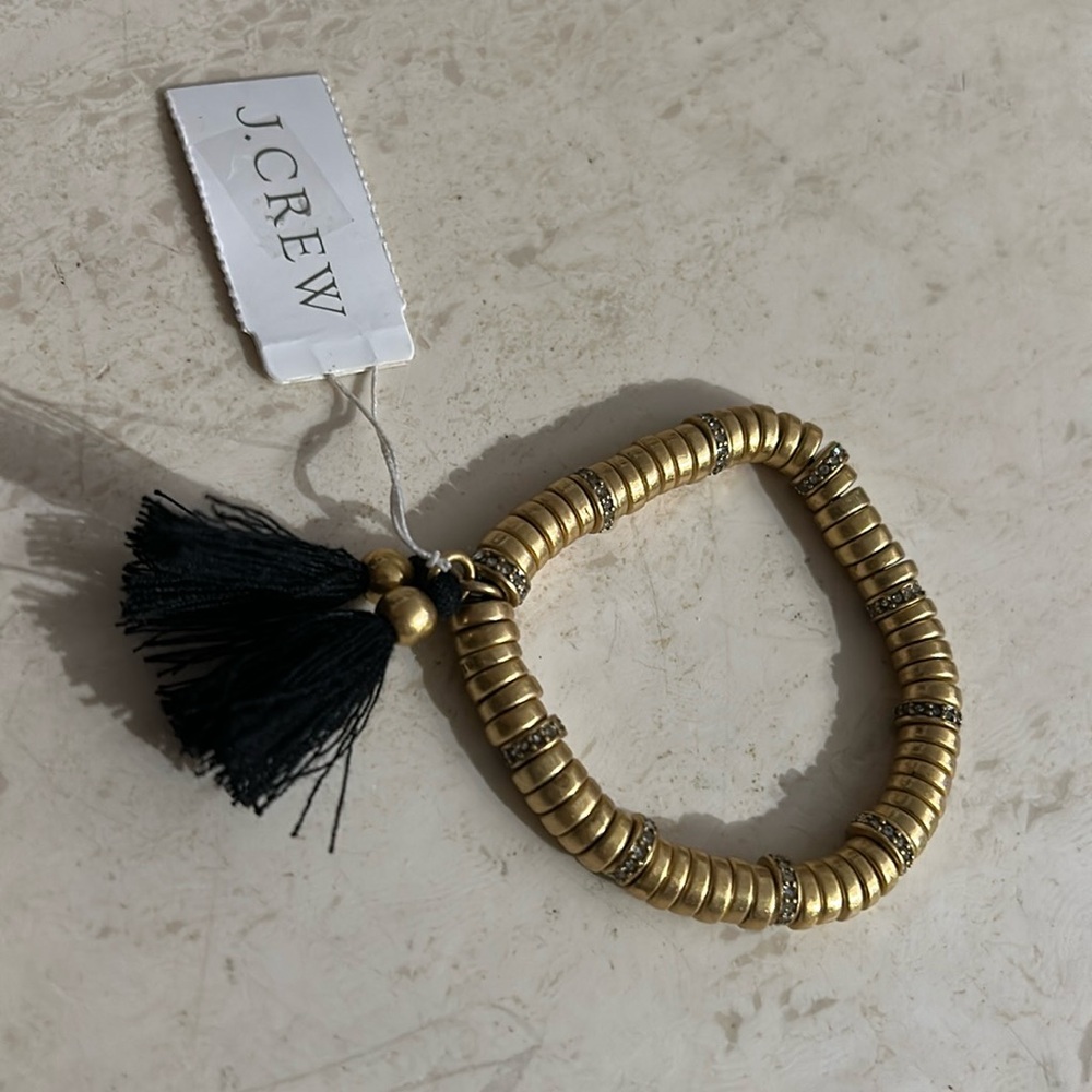 Goldtone J CREW stretchy bracelet w tassel